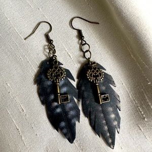 These handmade boho inspired feather earrings are made from tires and up-cycled